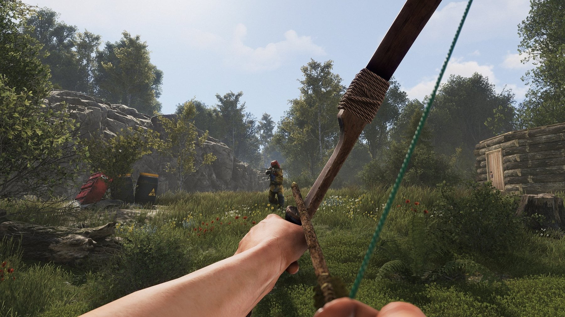 A hunting bow drawn in a pine forest